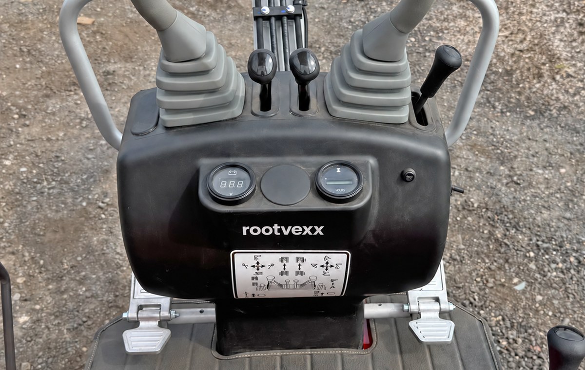 CREX6-M mini excavator, twin joysticks and foot pedals at the operator station